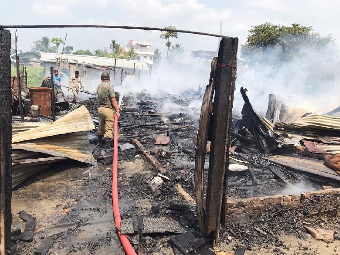 Fire and Emergency Services Personnel are seen the dousing fire that broke out at Padumpukhuri Lane-1 in Dimapur on September 10. (Morung Photo)